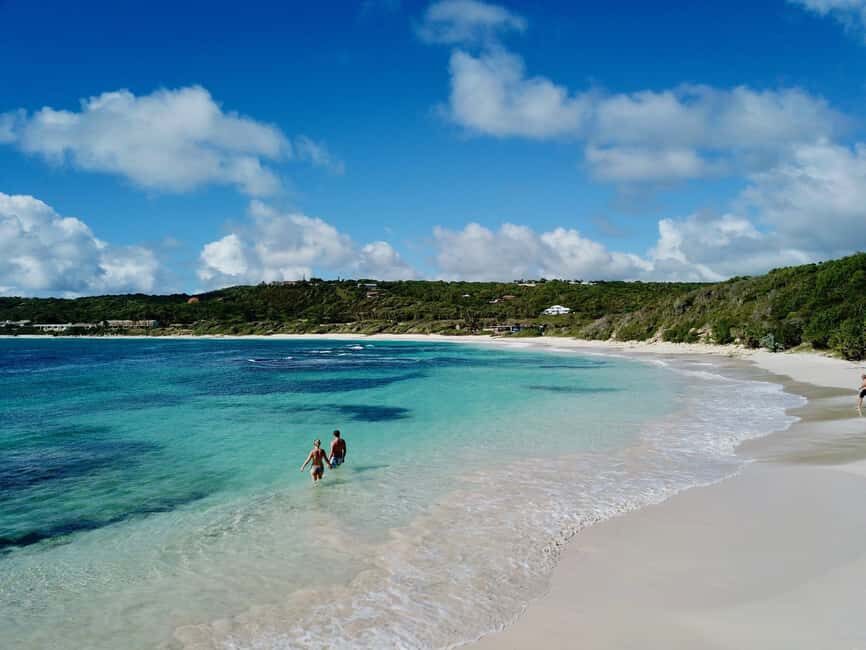From St John's: Half Moon Bay Beach Half-Day Trip by Van - Getting to the calm-water section: a short shoreline walk with a real payoff